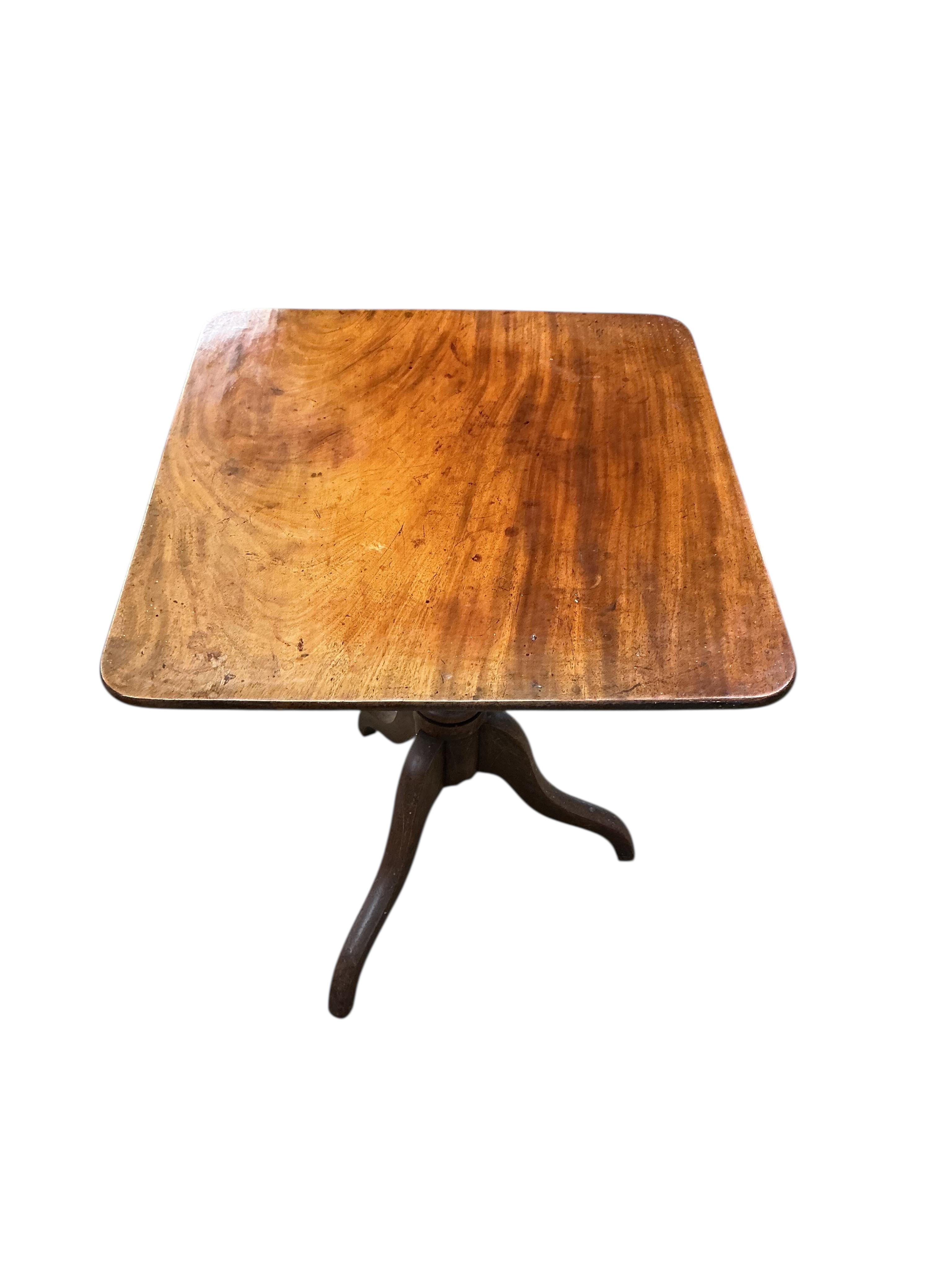 A Regency rectangular mahogany tilt top tripod tea table, width 65cm, depth 60cm, height 74cm